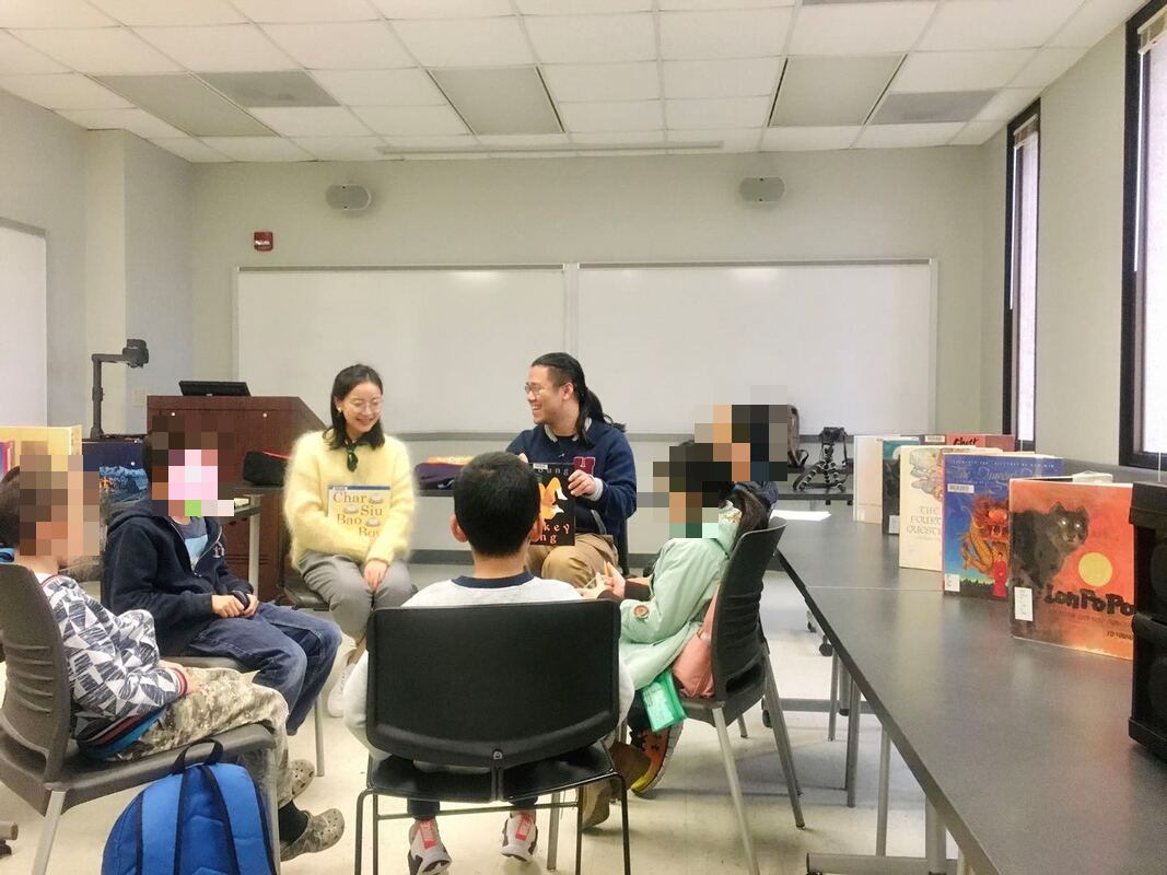 Children and facilitators reading together at the first book club meeting
