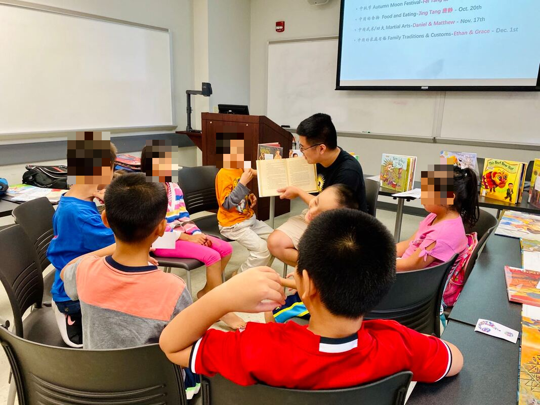 A read-aloud in the book club, children seated in a circle around the facilitator