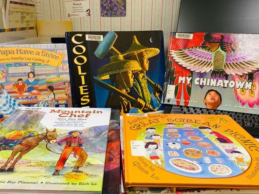 A stack of Asian American picturebooks used in the book club